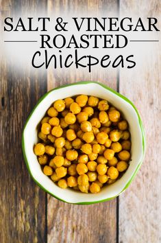 salt and vinegar roasted chickpeas in a white bowl on a wooden table with text overlay