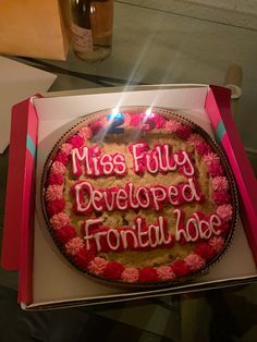 a birthday cake with the words miss fully developed frontload on it in a box