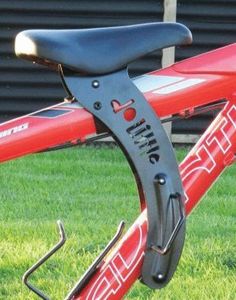 the handlebars are attached to the front end of a red bike in the grass