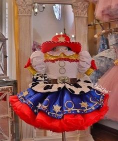 a dress made to look like a clown in front of a mirror