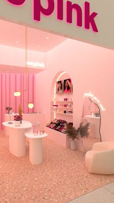 the pink store is decorated with white furniture and accessories for women's beauty products