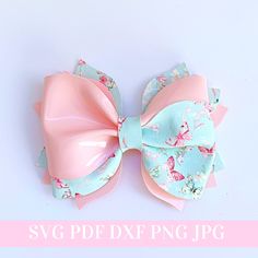 a pink and blue bow with flowers on it