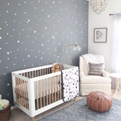 a baby's room with stars painted on the wall