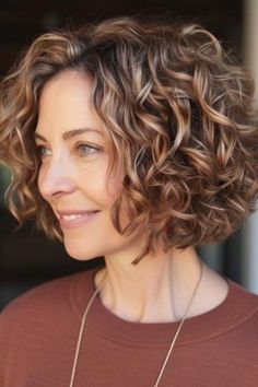 The curly A-line bob is a classic curly bob that remains sophisticated and timeless for lovers of achieving that modern twist but with a classic line. The bob hairstyle softly points out your facial features. Click here to check out more best curly hairstyles for women over 50. Cute Medium Curly Haircuts, Short Curly Hairstyles For Women, Bob Haircut Curly, Curly Short, Hairstyles For Women Over 50