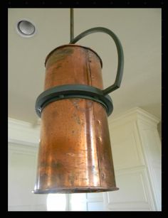 an old fashioned light fixture hanging from the ceiling