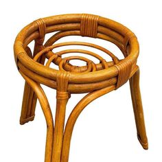 a wooden stool made out of wicker with four sections on the top and one section at the bottom