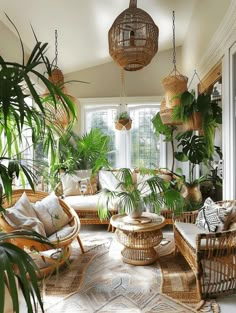 a living room filled with lots of plants and wicker furniture