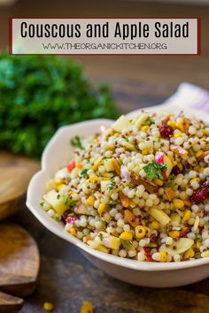 a white bowl filled with corn salad on top of a table