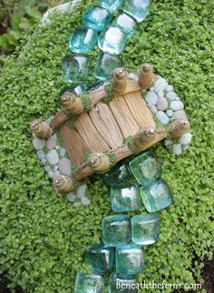 a garden decoration made out of glass blocks and rocks