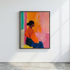 a woman sitting on a bench in front of a colorful painting hanging on the wall