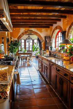 a large kitchen with wooden cabinets and marble counter tops, along with tile flooring