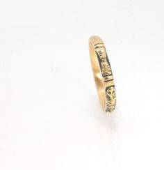 This is the most narrow of my Memento Mori rings at 3mm wide and is cast in 14k rich yellow gold. The Skeleton is flanked by intertwined hearts on one side.14k rich yellow gold and EnamelMade to Order. Usually ships in 3-5 days.This ring looks great as part of a stack, as a wedding band, a right-hand ring, or a promise ring, and all by its damn self, thank you very much. And as always, my rings are Unisex. Y’all wear what you want!I made these Memento Mori rings for my older sister Jill, a famou Yellow Gold Brass Stackable Promise Rings, Yellow Gold Brass Stackable Rings, 14k Gold Symbolic Rings With Engraving Option, Yellow Gold Brass Toe Stackable Rings, Yellow Gold Brass Rings For Anniversary, Ceremonial Yellow Gold Engraved Ring With Decorative Band, Symbolic Yellow Gold Promise Ring Engraved, Symbolic Yellow Gold Engraved Ring For Promise, Symbolic Yellow Gold Engraved Promise Ring