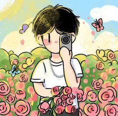 a person taking a photo with a cell phone in front of a field of flowers