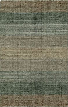 an area rug with different colors and patterns on the floor, including green, brown, beige