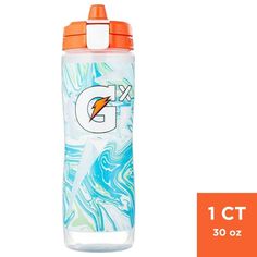 a water bottle with an orange lid and blue swirls