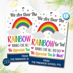 two rainbow gift tags with the words we are over the rainbow on them and an image of