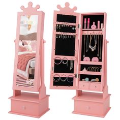 a pink jewelry cabinet with mirror and drawers