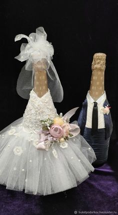 a wedding cake topper with a bride and groom figurine on the bottom