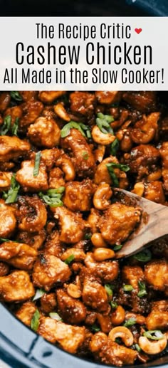 a slow cooker filled with cashew chicken and garnished with fresh basil