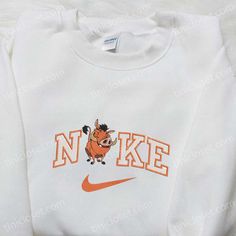 Introducing the Pumbaa x Nike Cartoon Embroidered Sweatshirt, a must-have for Disney enthusiasts! This cozy sweatshirt showcases an intricately embroidered Pumbaa character, adding a playful touch to your wardrobe. With its premium quality fabric and comfortable fit, it offers both style and comfort. Whether you’re out for a casual outing or cozying up at home, [...] Nike Cartoon, Nike Inspired, Mocha Bear, Cartoon Hoodie, Maroon Hoodie, Embroidered Shirts, Mike Wazowski, Corpse Bride, Perfect Family