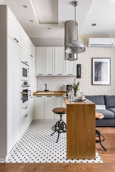 the kitchen is clean and ready to be used as a living room or dining area