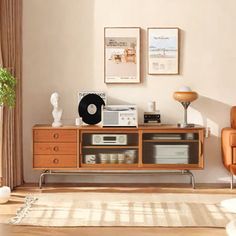 a living room scene with focus on the entertainment center and chair in the foreground