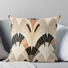 an art deco style pillow on a couch