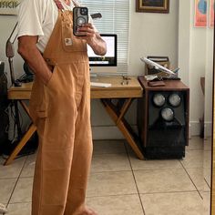 Vintage 1980s Carhartt Duck Bib Overall New W/O Tags Supper Baggy Fit Straight Wide Legs Carhartt Brown Color New Without Tags Triple-Stitched Main Seams Adjustable Elastic Suspenders For A Personalized Fit Plenty Of Pockets Hammer Loop Size 40 X 30 (Runs Smaller Please See Pics Wearing It) (I'm A Size 32) Measurements: (Flat Across) Waist: 22” Rise: 12” Hips: 24" Thighs: 14" Leg Openings: 9.5" Inseam: 30” Shoulders To Hem: 62" Made In Usa Men’s Carhartt Overalls, Tan Overalls Outfit, Mens Overalls Outfits, Overalls Outfit Men, Overalls Outfits, Canvas Work Pants, Stem Style, Carhartt Overalls, Streetwear Ideas