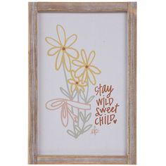 a framed print with flowers and the words stay wild sweet child