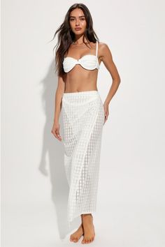 Throw on your best bikini and the 4th & Reckless Arles Ivory Pointelle Side-Tie Sarong Swim Cover-Up for a look that's certain to stun! Sheer, stretchy knit (with a chic, pointelle-inspired pattern throughout) shapes this sultry, sunny sarong that has a flattering fit, with a wrap-style design that ties at the side. Overlapping silhouette continues down to a maxi hem. Fit: This garment fits true to size. Length: Mid-calf length. Size medium Waist: Loosely Fitted. Hip: Loosely Fitted. Fabric: Fab Beachy White Cover-up For Party, Beachy White Party Cover-up, Elegant Bandeau Swimwear For Beach, Elegant White Bandeau Swimwear, Elegant Tie-side Swimwear For Beach Season, Elegant Strapless Swimwear For Beach, Elegant Tie-side Bottom Swimwear For Summer, Elegant Summer Swimwear With Tie-side Bottom, Elegant White Beach Season Cover-up