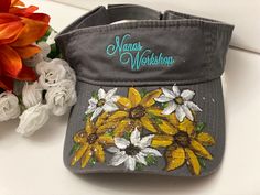 Is visors been hand-painted with sunflowers and daisies very fun and whimsical great to wear in the garden. Painting On Hats, Painting Hats, Sunflowers And Daisies, Visor Hat, Visor Hats, Artistic Designs, In The Garden, The Garden