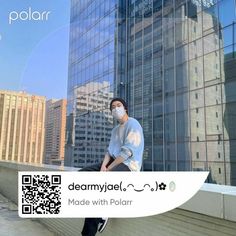 a man wearing a face mask standing in front of a tall building with the text made with polar on it