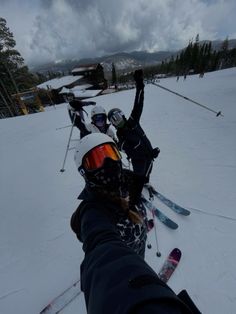 several skiers are lined up in the snow with their skis and poles sticking out