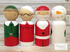 a group of wooden peg dolls standing next to each other