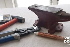 an assortment of tools are laying on a table