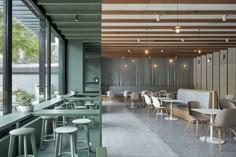 an empty restaurant with tables and stools