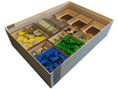 a box filled with lots of different types of toys in it's compartments,