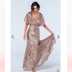 a woman is wearing a gold dress with sequins on it