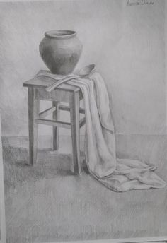 a black and white drawing of a vase on a stool next to a table with a towel draped over it