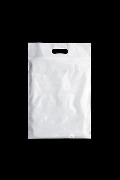 a white paper bag on a black background