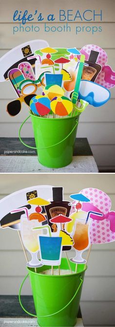 a bucket full of beach themed items sitting on top of a wooden table with the words life's a beach photo booth props