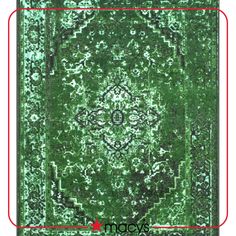 a green rug with an intricate design