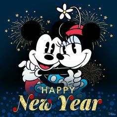 mickey and minnie kissing in front of fireworks with the words happy new year written on it