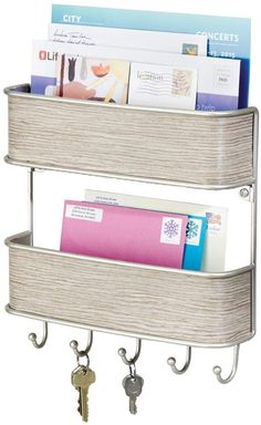 two tiered shelf with keys and magazines on it