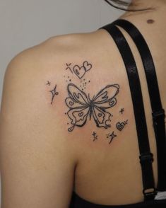 a woman with a butterfly tattoo on her upper back shoulder and the word love is written across it