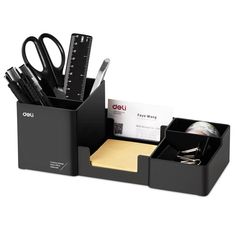 a black desk organizer with pens and scissors