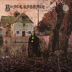 an album cover with a woman standing in the grass next to a house and trees