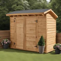 a large wooden shed with two potted plants next to it