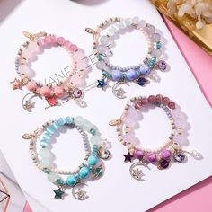 💗The kawaii Star Moon Cat Eye Crystal Bracelet can be a cute gift to celebrate birthdays, holidays and important days💗The star and moon so beautiful, and the temperament is full and unforgettable.💗Style:pink,purple,blue and green,💗Size: Bracelet diameter is about 5cm,Bead diameter is about 0.8/1cm,Weight about 32.30g Cat Eye Crystal, Bracelets With Charms, Kawaii Bracelet, Hand Chain Jewelry, Moon Cat, Pretty Jewelry Necklaces, Star And Moon, Beads Bracelet Design, Jewelry Accessories Ideas