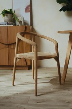 Create an organic feel to your space with this natural teakwood chair featuring modern curved arms and round cane seating. Place in the dining room for entertaining guests or in the office for an elegant look. Natural teak wood frame Rounded cane seating Use as a dining chair or office chair Indoor use only Handmade from a natural material, variance in appearance and coloring may occur Fully assembled Elegant Office Chair, Interior Design Chair, Modern Spanish Home, Wood Chair Design, Natural Teak Wood, Indoor Chairs, Elegant Office, Furniture Trends, The Dining Room